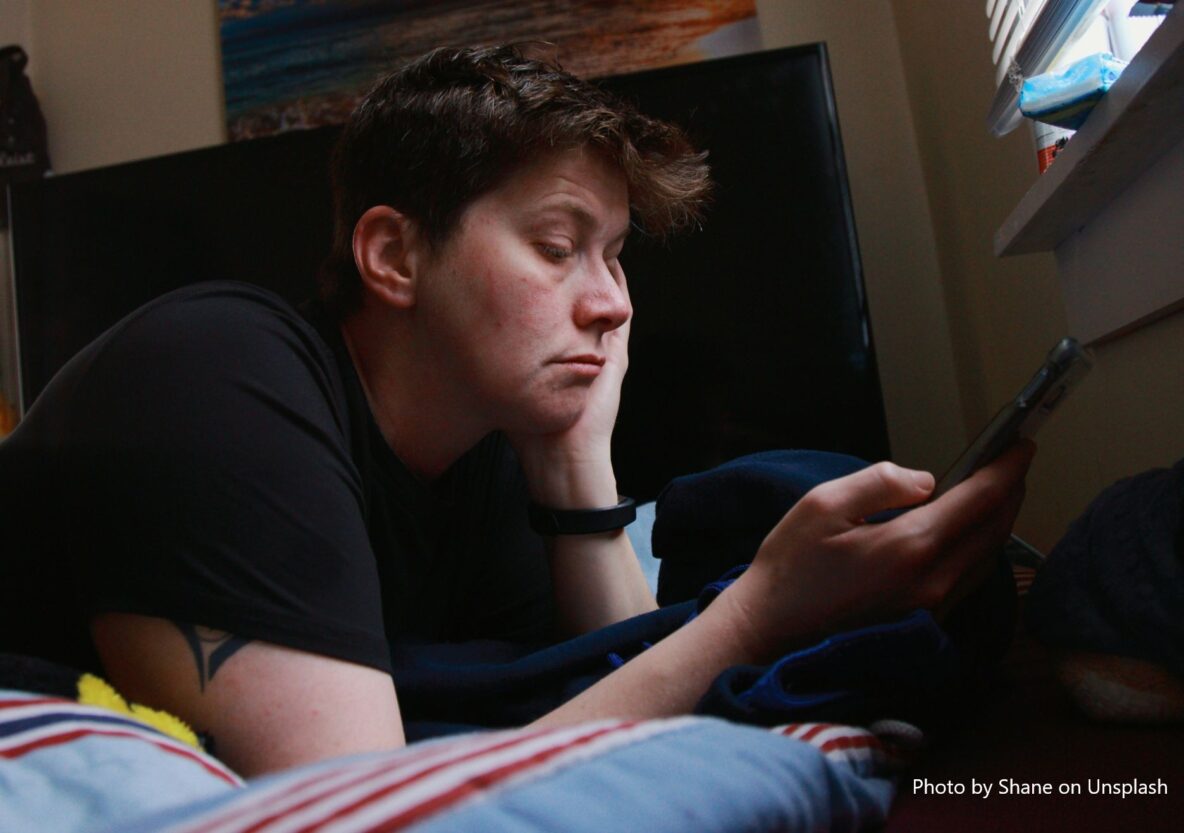 Teen scrolling on phone