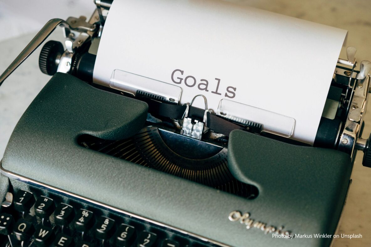a piece of paper in a typewriter with the word 'Goals' typed onto it